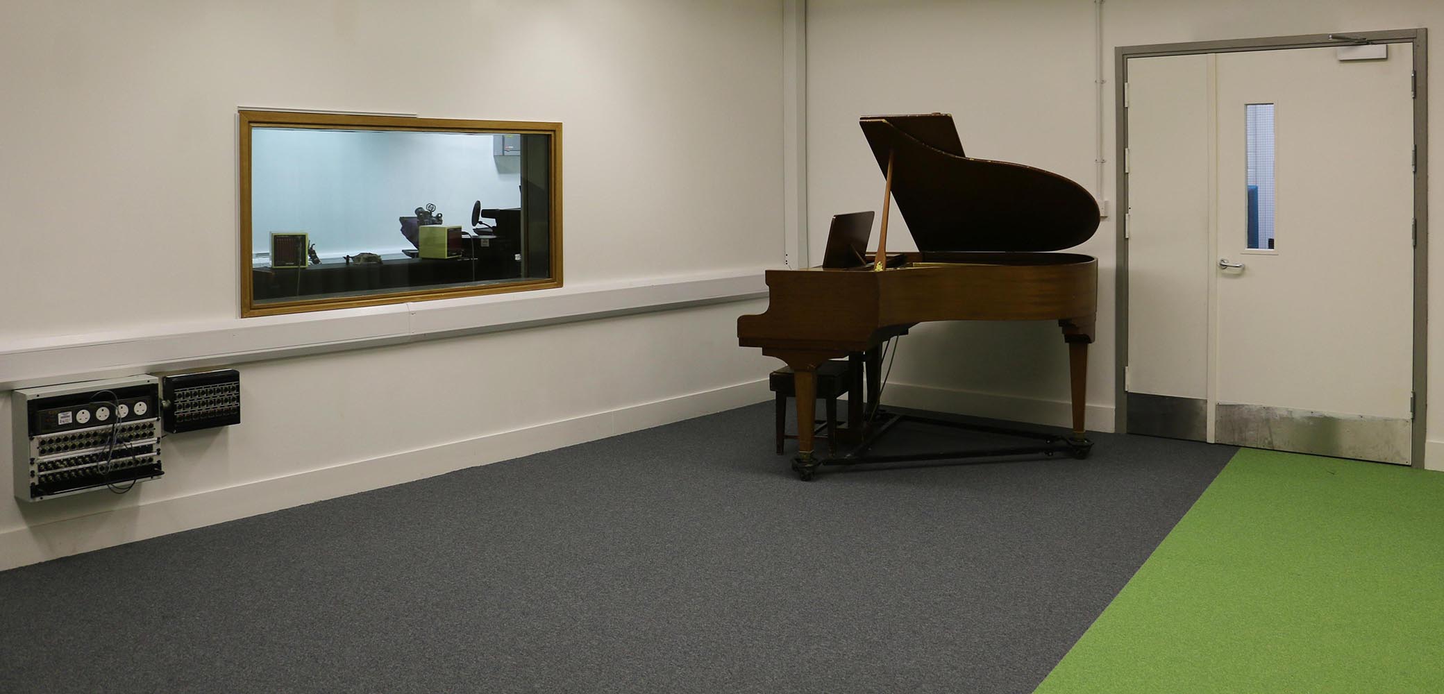 Live Room A - professional recording space with grand piano